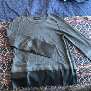 Line sweater with black leather trim